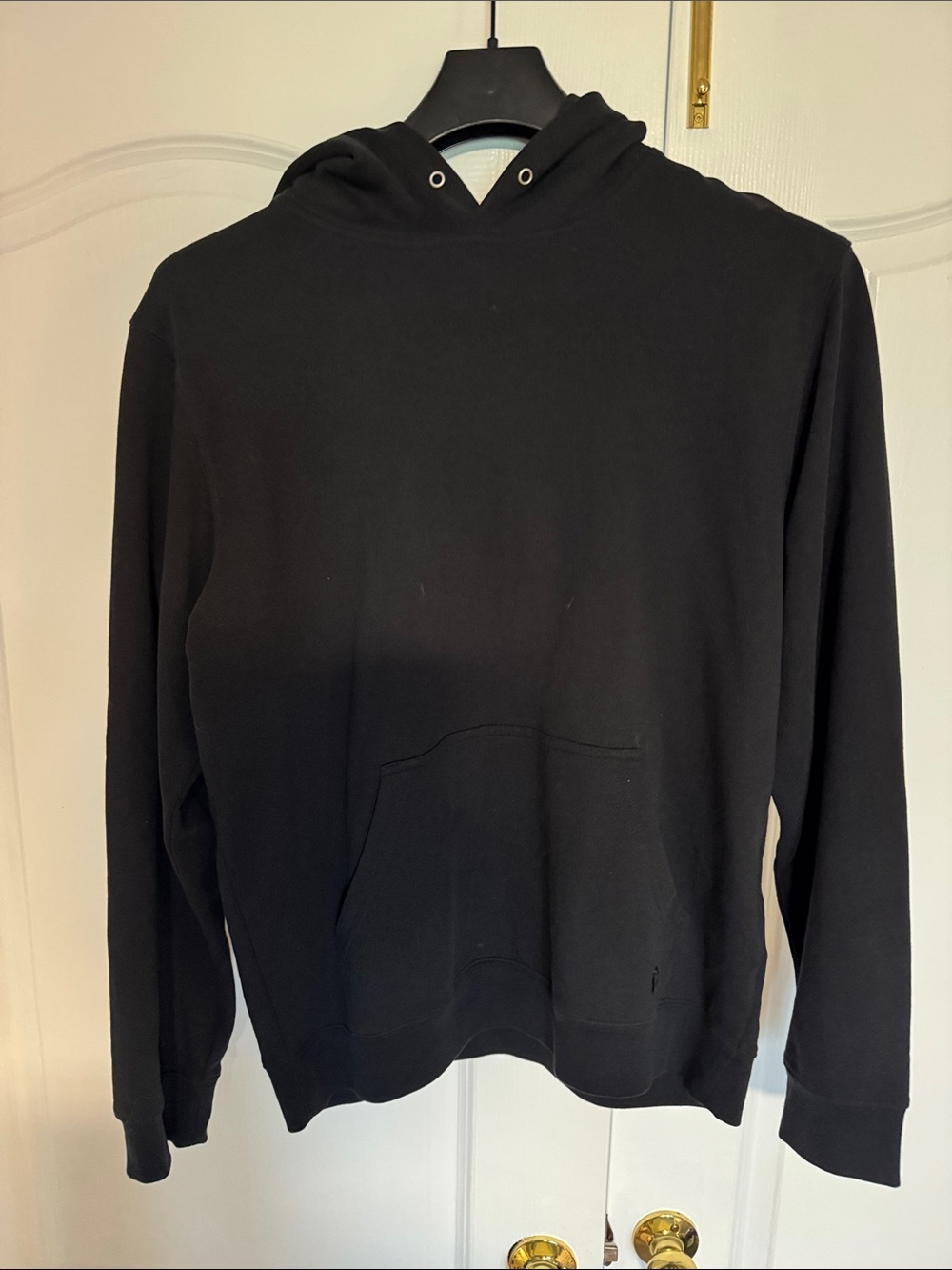 Coach NY Men's Black Pullover Hoodie with embossed coach branding on hood